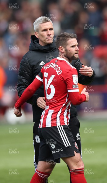 230422 - Sheffield United v Cardiff City - Sky Bet Championship - Manager Steve Morison of Cardiff greets Oliver Norwood of Sheffield Utd at the end of the match