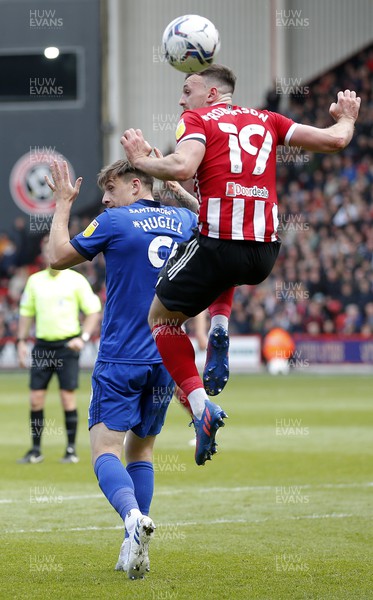 230422 - Sheffield United v Cardiff City - Sky Bet Championship - Jordan Hugill of Cardiff is out jumped by Jack Robinson of Sheffield Utd