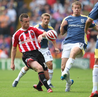 30.08.08...Sheffield United v Cardiff City, Coca Cola Championship -  Cardiff's Paul Parry tangles with United's Michael Tonge 