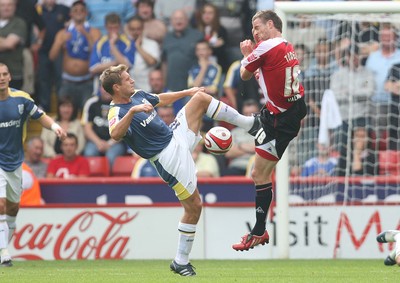 30.08.08...Sheffield United v Cardiff City, Coca Cola Championship -  Cardiff's Stephen McPhail challenges United's Michael Tonge for the ball 