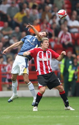 30.08.08...Sheffield United v Cardiff City, Coca Cola Championship -  Cardiff's Roger Johnson and United's Darius Henderson contest the ball 