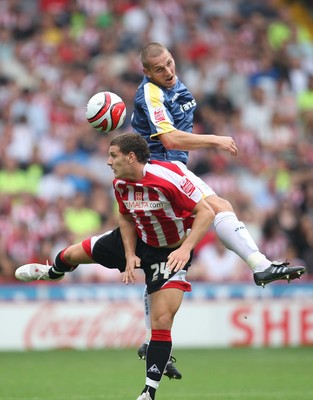 30.08.08...Sheffield United v Cardiff City, Coca Cola Championship -  Cardiff's Darren Purse wins the ball from United's Billy Sharp 