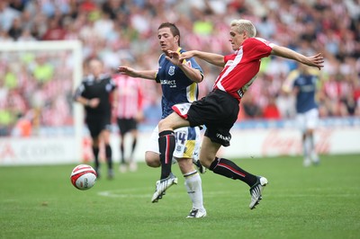 30.08.08...Sheffield United v Cardiff City, Coca Cola Championship -  United's Matt Kilgallon beats Cardiff's Ross McCormack to the ball 