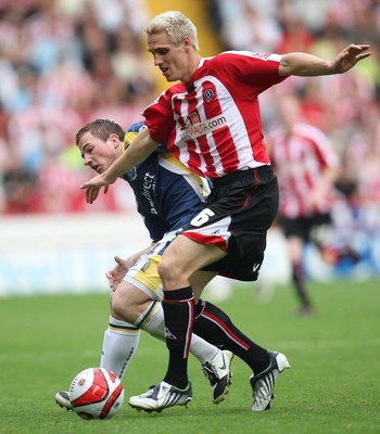 30.08.08...Sheffield United v Cardiff City, Coca Cola Championship -  United's Matt Kilgallon beats Cardiff's Ross McCormack to the ball 