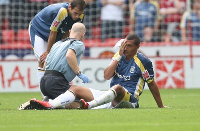 30.08.08...Sheffield United v Cardiff City, Coca Cola Championship -  Cardiff's Jay Bothroyd receives treatment after colliding with United's Sun Jihai 