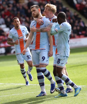 030426 - Sheffield United v Swansea City - Sky Bet Championship - Zan Vipotnik of Swansea celebrates scoring penalty goal to equal scores 1-1 with Melker Widell of Swansea and Malick Yalcouye of Swansea