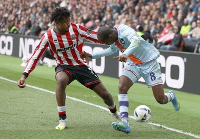 030426 - Sheffield United v Swansea City - Sky Bet Championship - Malick Yalcouye of Swansea and Andre Brooks of Sheffield Utd
