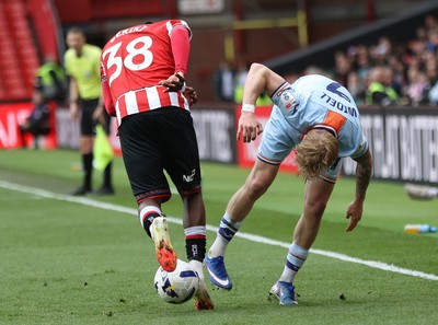 030426 - Sheffield United v Swansea City - Sky Bet Championship - Melker Widell of Swansea and Femi Seriki of Sheffield Utd