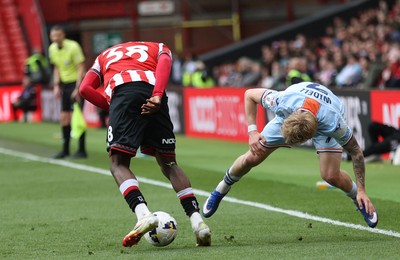 030426 - Sheffield United v Swansea City - Sky Bet Championship - Melker Widell of Swansea and Femi Seriki of Sheffield Utd