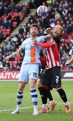 030426 - Sheffield United v Swansea City - Sky Bet Championship - Cameron Burgess of Swansea tries a header but is saved by Goalkeeper Adam Davies of Sheffield Utd