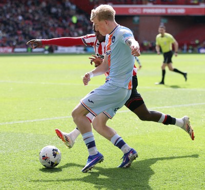 030426 - Sheffield United v Swansea City - Sky Bet Championship - Melker Widell of Swansea and Femi Seriki of Sheffield Utd