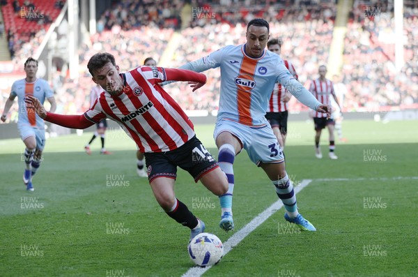 030426 - Sheffield United v Swansea City - Sky Bet Championship - Adam Idah of Swansea and Harrison Burrows of Sheffield United
