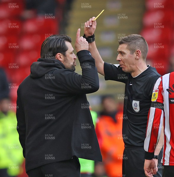 110223 - Sheffield United v Swansea City - Sky Bet Championship - Head Coach Russell Martin of Swansea gets a yellow card from Referee Matthew Donohue