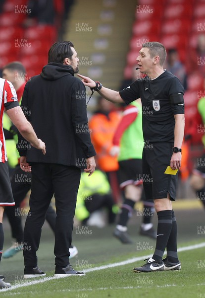 110223 - Sheffield United v Swansea City - Sky Bet Championship - Head Coach Russell Martin of Swansea gets a yellow card from Referee Matthew Donohue