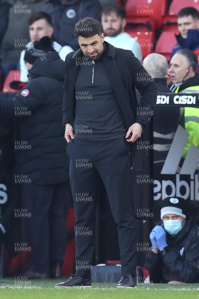 190222 - Sheffield United v Swansea City - Sky Bet Championship - Head Coach Russell Martin  of Swansea dejected near the end of the match losing 4-0