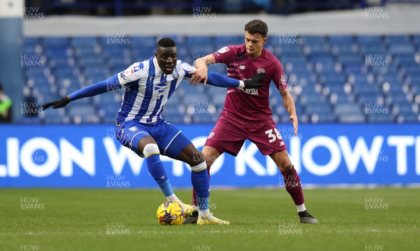 231223 - Sheffield Wednesday v Cardiff City - Sky Bet Championship - Perry Ng of Cardiff and Bambo Diaby of Sheffield Wednesday