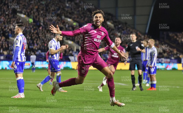 231223 - Sheffield Wednesday v Cardiff City - Sky Bet Championship - Kion Etete of Cardiff cele on winning goal with Sheff Wed players downcast in background