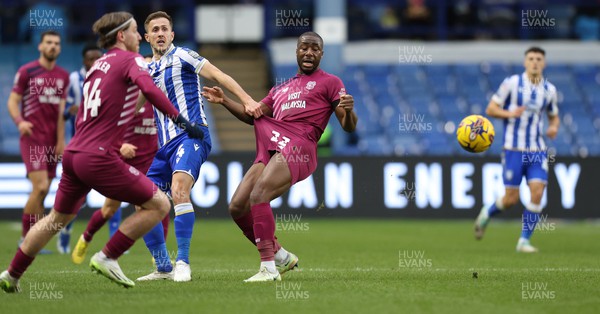 231223 - Sheffield Wednesday v Cardiff City - Sky Bet Championship - Yakou Meite of Cardiff is debagged by Will Vaulks of Sheffield Wednesday