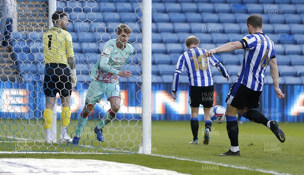 130421 - Sheffield Wednesday v Swansea City - Sky Bet Championship - Jay Fulton of Swansea heads in the 2nd goal despite the efforts of Barry Bannan of Sheffield Wednesday