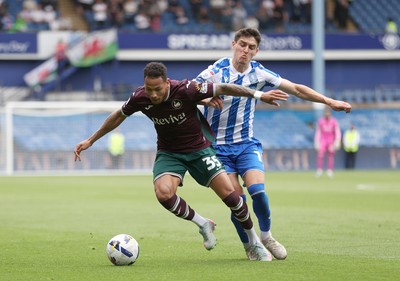 300825 - Sheffield Wednesday v Swansea City - Sky Bet Championship - Ronald of Swansea and Olaf Kobacki of Sheffield Wednesday