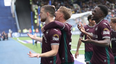 300825 - Sheffield Wednesday v Swansea City - Sky Bet Championship - Zan Vipotnik of Swansea celebrates opening the score with the 1st goal of the match in the 2nd half with Ethan Galbraith of Swansea and Zeidane Inoussa of Swansea
