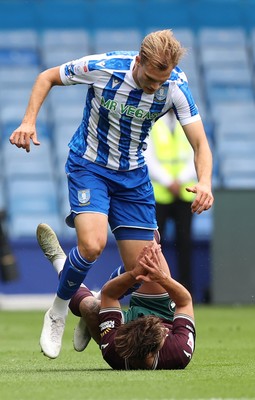 300825 - Sheffield Wednesday v Swansea City - Sky Bet Championship - Goncalo Franco of Swansea grounded by Svante Ingelsson of Sheffield Wednesday