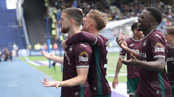 300825 - Sheffield Wednesday v Swansea City - Sky Bet Championship - Zan Vipotnik of Swansea celebrates opening the score with the 1st goal of the match in the 2nd half with Ethan Galbraith of Swansea and Zeidane Inoussa of Swansea