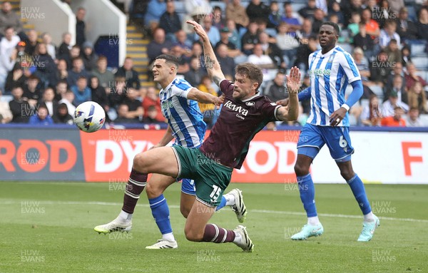 300825 - Sheffield Wednesday v Swansea City - Sky Bet Championship - Cameron Burgess of Swansea and Bailey Cadamarteri of Sheffield Wednesday