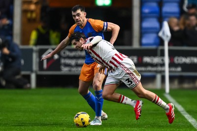 151125 - Shrewsbury Town v Newport County - Sky Bet League 2 - Anthony Driscoll-Glennon of Newport County is fouled by John Marquis of Shrewsbury Town battles for the ball