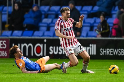 151125 - Shrewsbury Town v Newport County - Sky Bet League 2 - Ben Lloyd of Newport County is fouled by Tommy McDermott of Shrewsbury Town