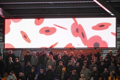 151125 - Shrewsbury Town v Newport County - Sky Bet League 2 - Newport County Fan observe the minutes silence before the game
