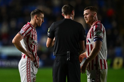 151125 - Shrewsbury Town v Newport County - Sky Bet League 2 - Referee Elliott Swallow speaks to Lee Jenkins of Newport County and Ciaran Brennan of Newport County