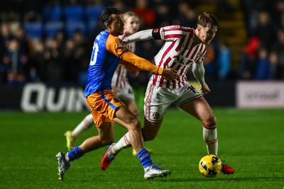 151125 - Shrewsbury Town v Newport County - Sky Bet League 2 - Ged Garner of Newport County is fouled by Tom Sang of Shrewsbury Town