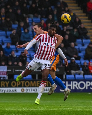 151125 - Shrewsbury Town v Newport County - Sky Bet League 2 - Akinwale Odimayo of Newport County jumps up to win the high ball
