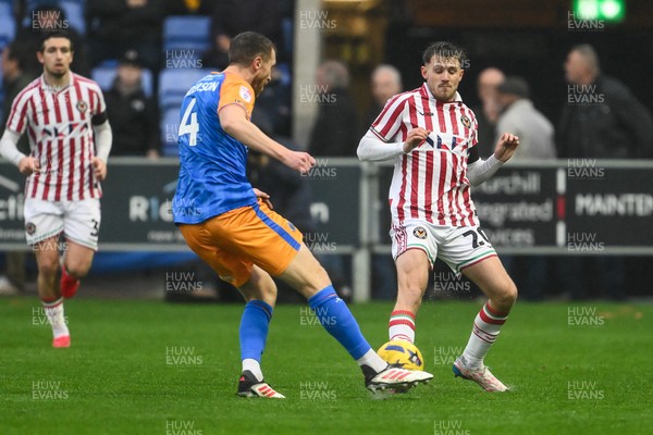 151125 - Shrewsbury Town v Newport County - Sky Bet League 2 - Ben Lloyd of Newport County is tackled by Tom Anderson of Shrewsbury Town