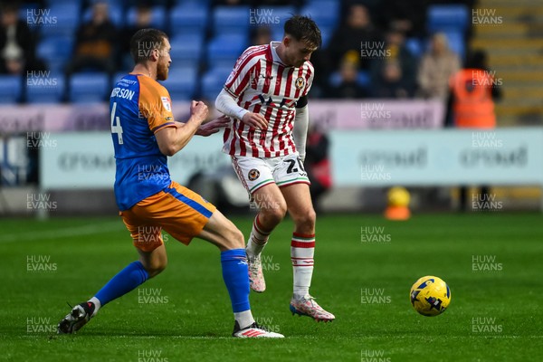 151125 - Shrewsbury Town v Newport County - Sky Bet League 2 - Ben Lloyd of Newport County is tackled by Tom Anderson of Shrewsbury Town