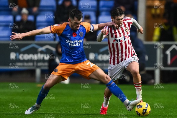 151125 - Shrewsbury Town v Newport County - Sky Bet League 2 - Anthony Driscoll-Glennon of Newport County and John Marquis of Shrewsbury Town battles for the ball