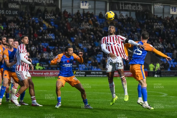 151125 - Shrewsbury Town v Newport County - Sky Bet League 2 - Akinwale Odimayo of Newport County jumps up to win the high ball