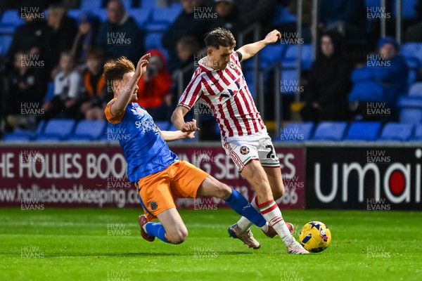 151125 - Shrewsbury Town v Newport County - Sky Bet League 2 - Ben Lloyd of Newport County is fouled by Tommy McDermott of Shrewsbury Town