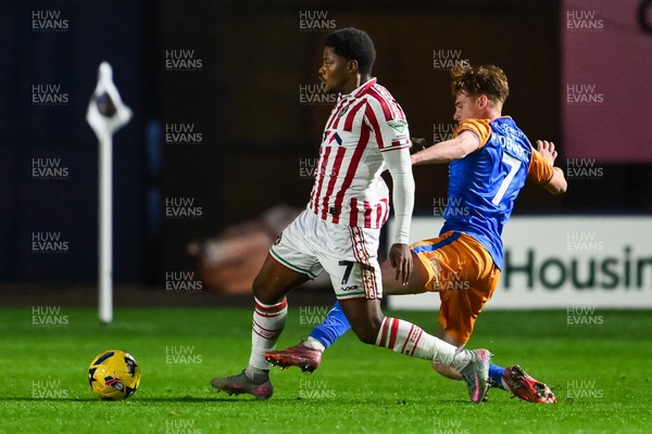 151125 - Shrewsbury Town v Newport County - Sky Bet League 2 - Bobby Kamwa of Newport County is tackled by Tommy McDermott of Shrewsbury Town