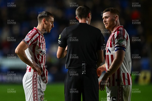 151125 - Shrewsbury Town v Newport County - Sky Bet League 2 - Referee Elliott Swallow speaks to Lee Jenkins of Newport County and Ciaran Brennan of Newport County