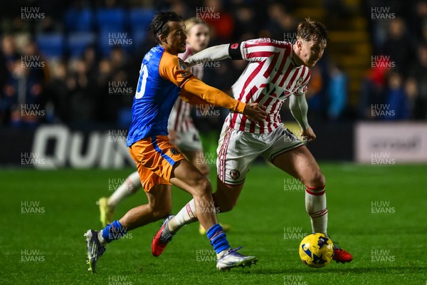 151125 - Shrewsbury Town v Newport County - Sky Bet League 2 - Ged Garner of Newport County is fouled by Tom Sang of Shrewsbury Town