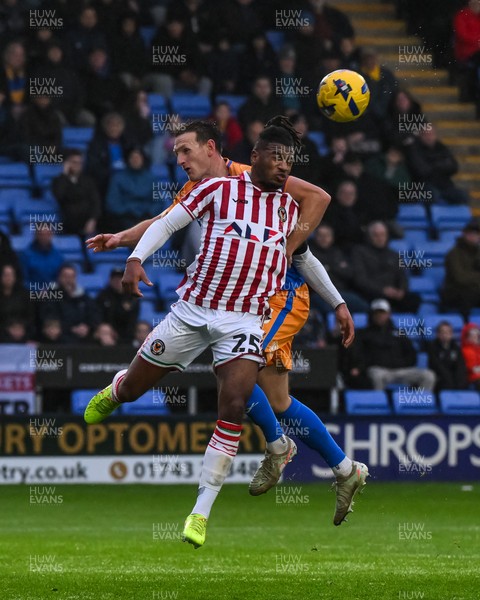 151125 - Shrewsbury Town v Newport County - Sky Bet League 2 - Akinwale Odimayo of Newport County jumps up to win the high ball