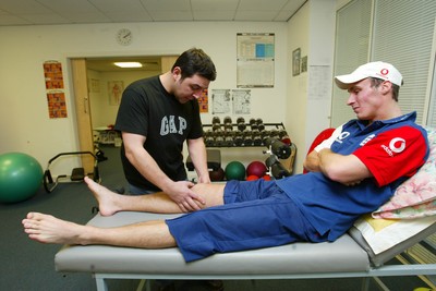 140203 - Glamorgan and England cricketer Simon Jones receiving treatment for his injury from Erjan Mustafa, sports osteopath/physio at Sophia Gardens, Cardiff