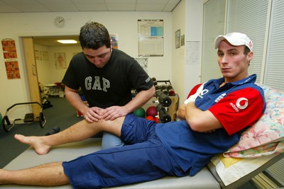 140203 - Glamorgan and England cricketer Simon Jones receiving treatment for his injury from Erjan Mustafa, sports osteopath/physio at Sophia Gardens, Cardiff