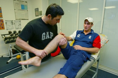 140203 - Glamorgan and England cricketer Simon Jones receiving treatment for his injury from Erjan Mustafa, sports osteopath/physio at Sophia Gardens, Cardiff