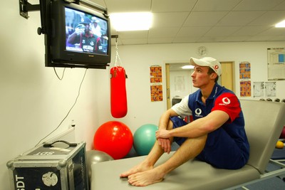 140203 - Glamorgan and England cricketer Simon Jones watches the Cricket World Cup on television after receiving treatment for his injury at Sophia Gardens, Cardiff