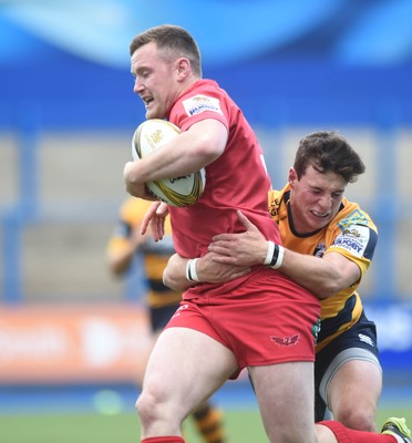 150815 - Singha Premiership Rugby 7sScarlets Iolo Evans is tackled by Owen Jenkins of the Blues