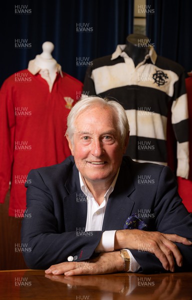 060722 - The Greatest Try Anniversary with Sir Gareth Edwards - Sir Gareth Edwards with three of his match warn shirts, including the Barbarian shirt worn when he scored “The Greatest Try” against New Zealand in 1973 A commissioned painting to mark Sir Gareth Edwards’ 75th birthday, 50th wedding anniversary and 50 years since scoring “The Greatest Try” was unveiled at the same time