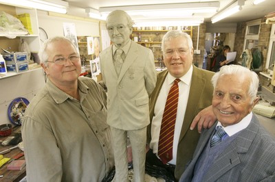 22.04.09 Welsh Rugby... L-r Sculptor Roger Andrews, Dennis Gethin President of the Welsh Rugby Union and Stan Thomas with the design for the statue of Sir Tasker Watkins which is nearing completion. 